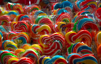 Colorful swirl lollipops at confectionery. sweet candy for kids party. candy day concept.