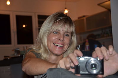 Portrait of woman photographing