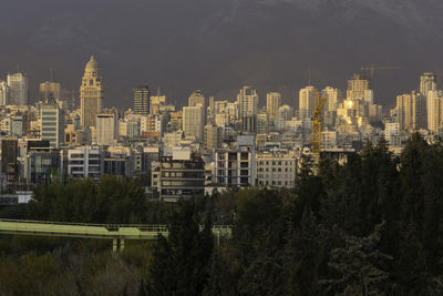 High angle view of buildings in city against sky