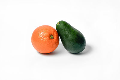 Close-up of fruits against white background