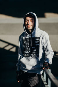 Portrait of young man standing outdoors