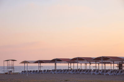 Scenic view of beach against sky during sunset