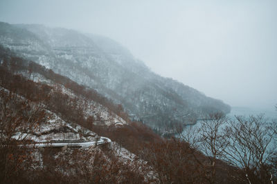 Scenic view of mountains during foggy weather