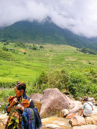 Man sitting on grassy field