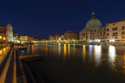 Illuminated buildings in city at night