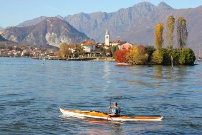 Man kayaking on lake maggiore