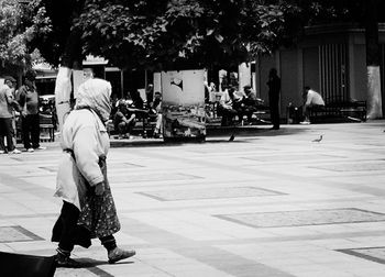People walking on street in city