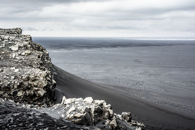 Scenic view of sea against cloudy sky