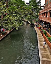 High angle view of people by canal