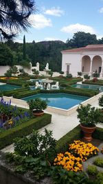 View of formal garden with buildings in background