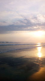 Scenic view of beach against sky during sunset