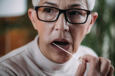 Close-up portrait of man wearing eyeglasses