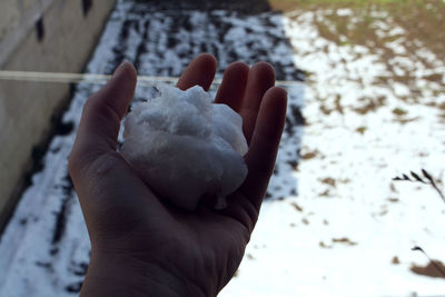 Close-up of hand holding ice cream