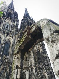 Low angle view of bell tower against sky