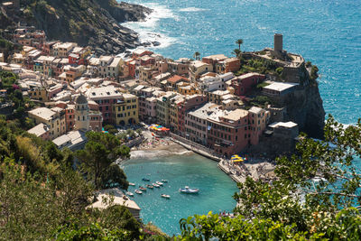 High angle view of townscape by sea