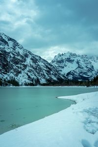 Scenic view of snowcapped mountains against sky during winter