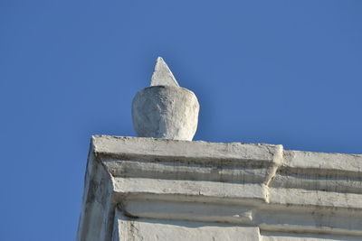 Low angle view of white structure against clear blue sky
