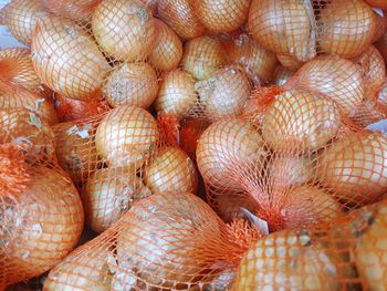 Full frame shot of onions for sale in market