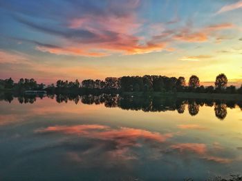 Scenic view of lake against sky during sunset