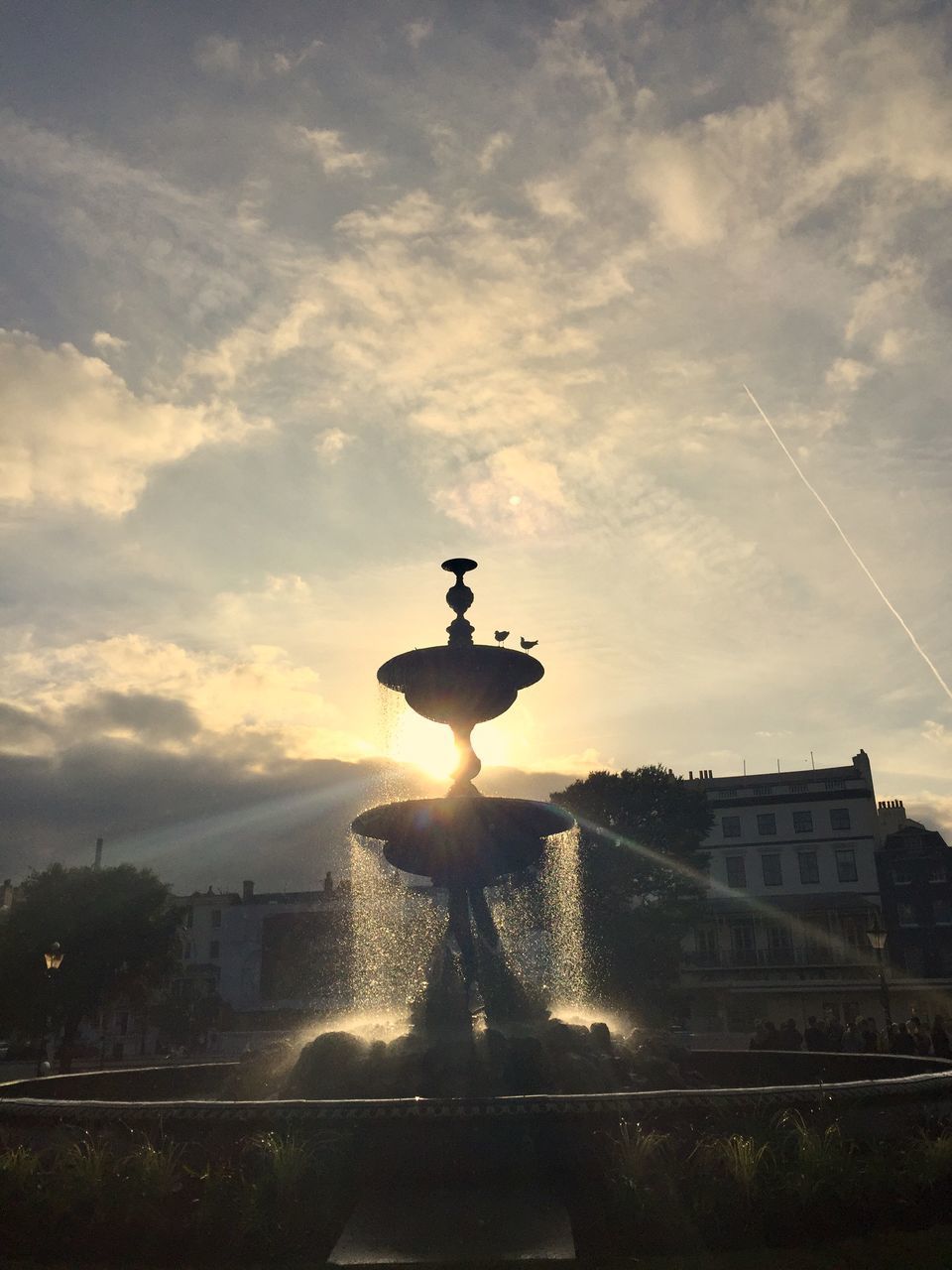 SILHOUETTE FOUNTAIN AGAINST SKY DURING SUNSET