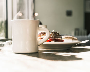 Close-up of coffee cup on table