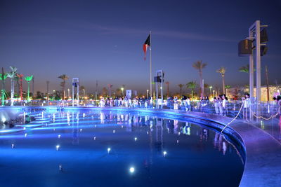 Panoramic view of illuminated city against clear sky at night