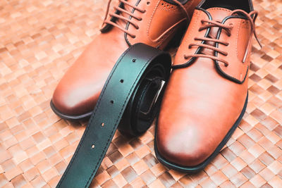 High angle view of shoes on tiled floor