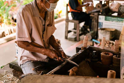 Close-up of man working in factory