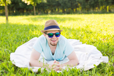 Full length of senior woman wearing hat on field