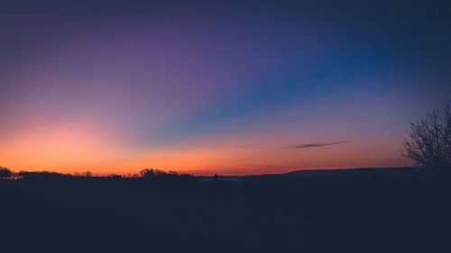 Scenic view of silhouette landscape against sky during sunset