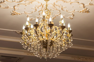 Low angle view of illuminated chandelier