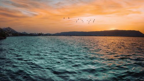 Scenic view of sea against sky during sunset