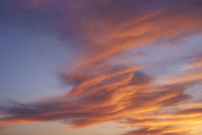 Low angle view of dramatic sky during sunset