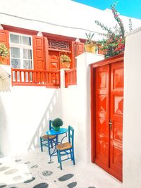 Chairs and tables against door