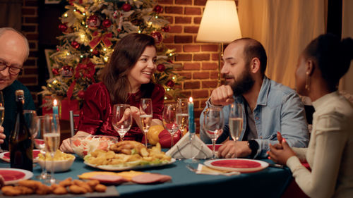 Portrait of woman having food at home