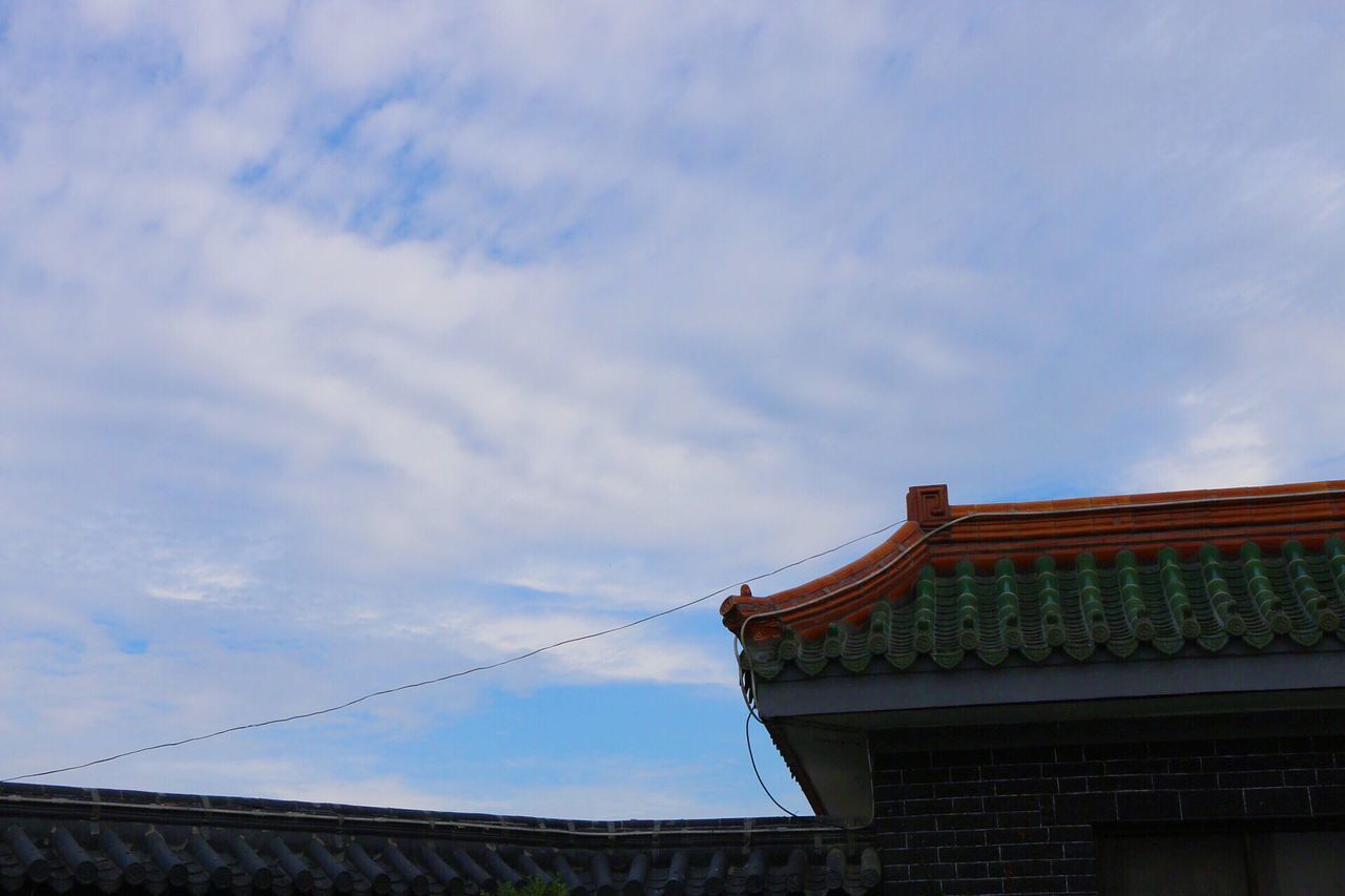 architecture, built structure, low angle view, building exterior, sky, high section, roof, cloud - sky, cloud, building, day, outdoors, blue, no people, house, place of worship, residential structure, cloudy, residential building, religion