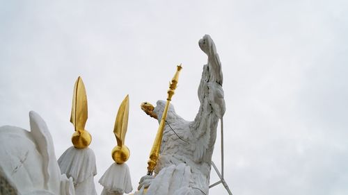 Low angle view of statue against sky