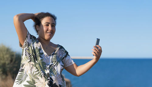 Young woman using mobile phone