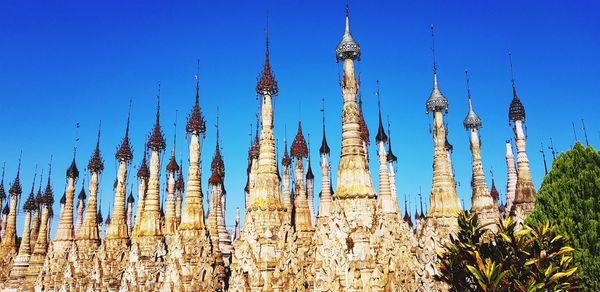 Low angle view of plants on field against blue sky