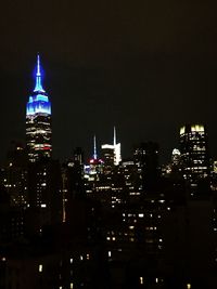 Low angle view of modern buildings at night