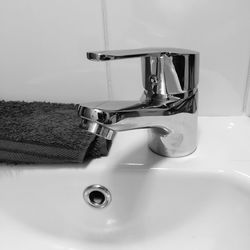 Close-up of faucet in bathroom