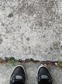 Low section of man standing on floor