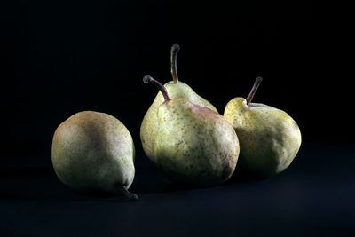 Still life - group of pears on black background