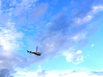 Low angle view of airplane flying in sky