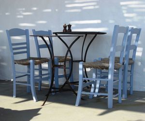 Chairs arranged at table against wall