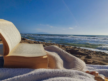  romance of the sea. reading on the sea. book on the beath