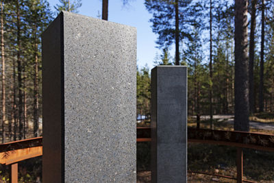 Close-up of stone cross in cemetery