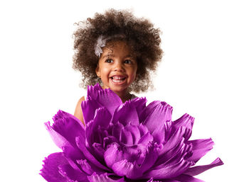 Portrait of smiling girl against white background