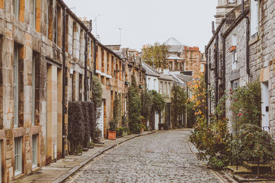 Street amidst buildings in city, circus lane, edinburgh, scotland 