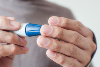 Close-up of hand holding smart phone